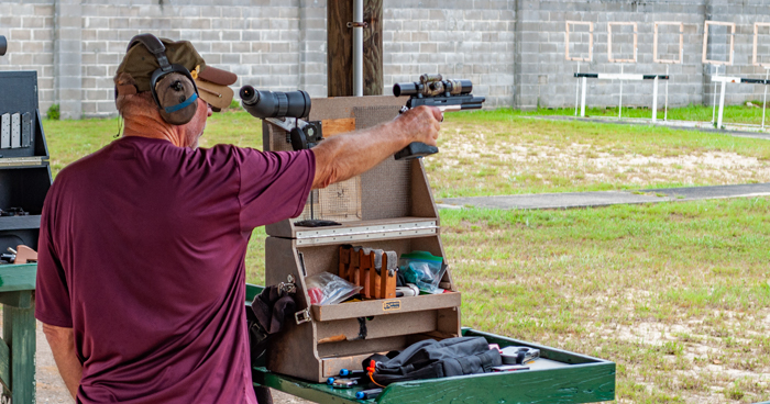 Man shooting precision pistol competition