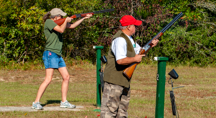Female shooting trap second competitor waits turn